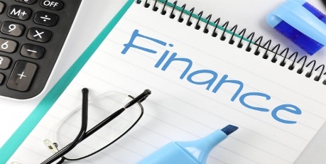 The word finance written on a notebook