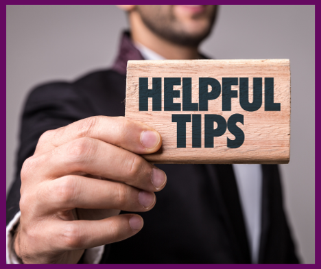 A man holding a sign that says helpful tips